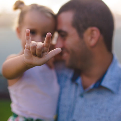 A father holding his daughter